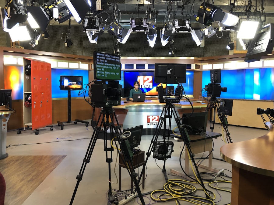 Television studio with cameras, lighting rig and a presenter desk
